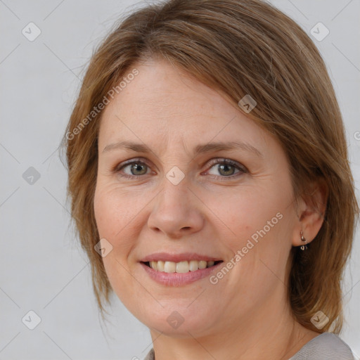 Joyful white adult female with medium  brown hair and brown eyes