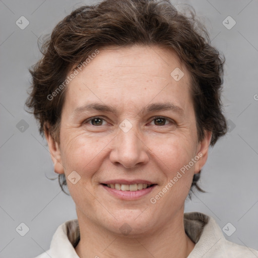 Joyful white adult female with short  brown hair and brown eyes