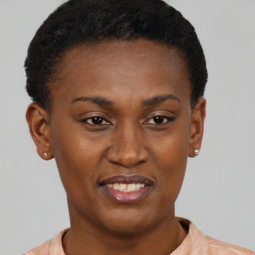 Joyful black young-adult female with short  brown hair and brown eyes