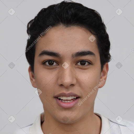 Joyful latino young-adult male with short  black hair and brown eyes