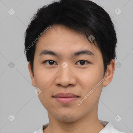 Joyful asian young-adult male with short  black hair and brown eyes