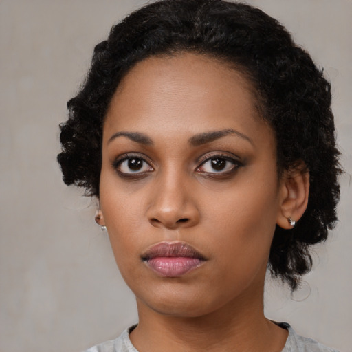 Neutral black young-adult female with medium  black hair and brown eyes