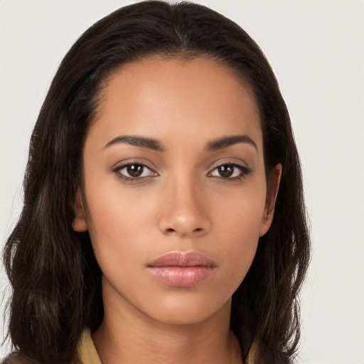 Neutral latino young-adult female with long  brown hair and brown eyes