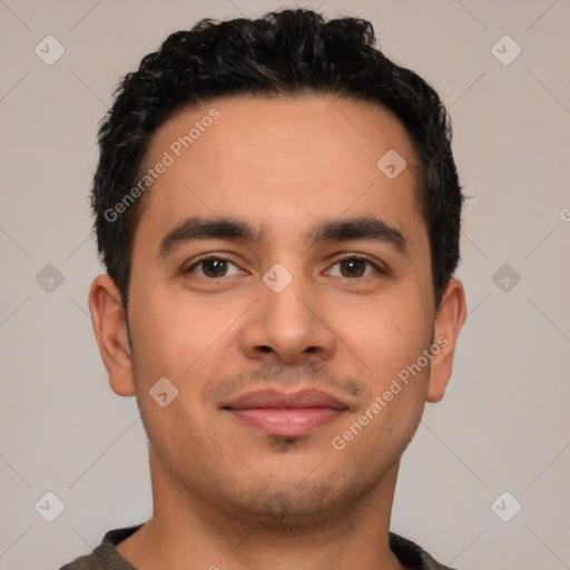 Joyful latino young-adult male with short  black hair and brown eyes