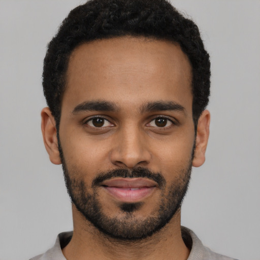 Neutral black young-adult male with short  black hair and brown eyes