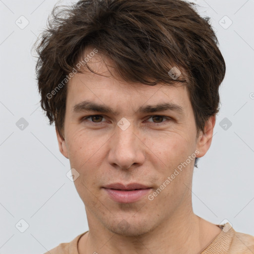 Joyful white adult male with short  brown hair and grey eyes