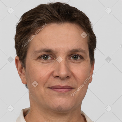 Joyful white adult male with short  brown hair and brown eyes