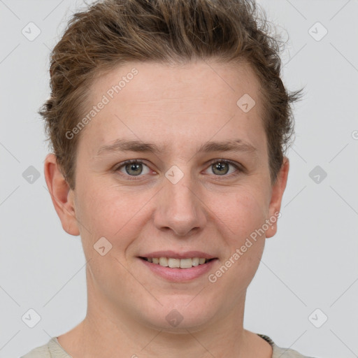 Joyful white young-adult female with short  brown hair and grey eyes