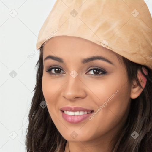 Joyful white young-adult female with long  black hair and brown eyes