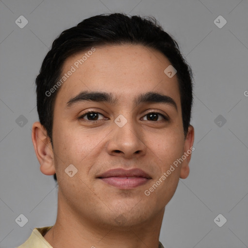 Joyful latino young-adult male with short  brown hair and brown eyes