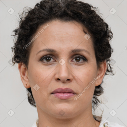 Joyful white adult female with short  brown hair and brown eyes