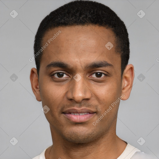 Joyful black young-adult male with short  brown hair and brown eyes