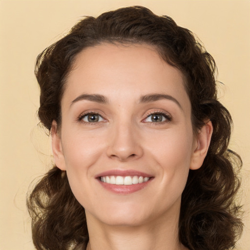 Joyful white young-adult female with medium  brown hair and brown eyes