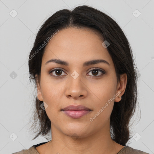 Joyful latino young-adult female with medium  brown hair and brown eyes