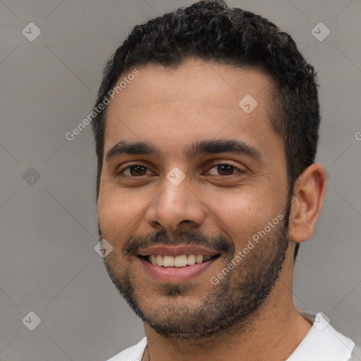 Joyful white young-adult male with short  black hair and brown eyes