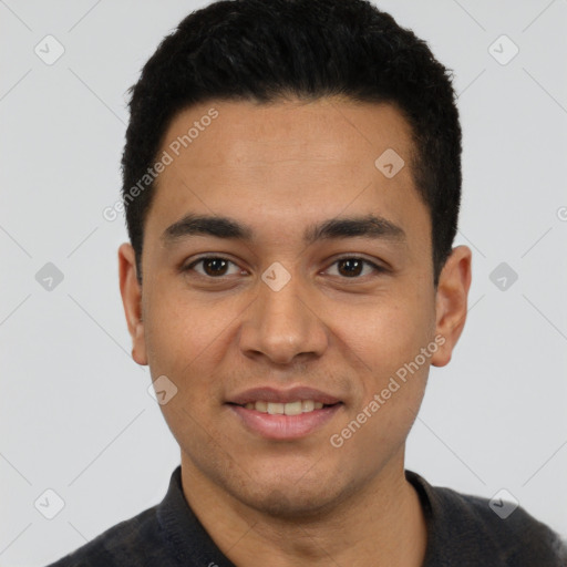 Joyful latino young-adult male with short  black hair and brown eyes