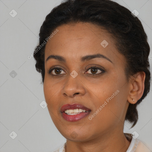 Joyful black young-adult female with short  brown hair and brown eyes