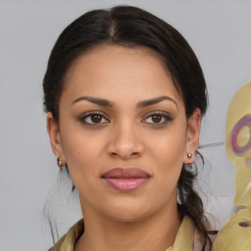 Joyful latino young-adult female with medium  brown hair and brown eyes