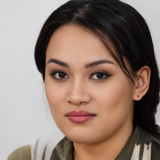 Joyful asian young-adult female with medium  black hair and brown eyes