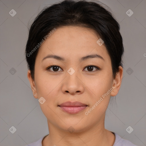 Joyful asian young-adult female with short  brown hair and brown eyes