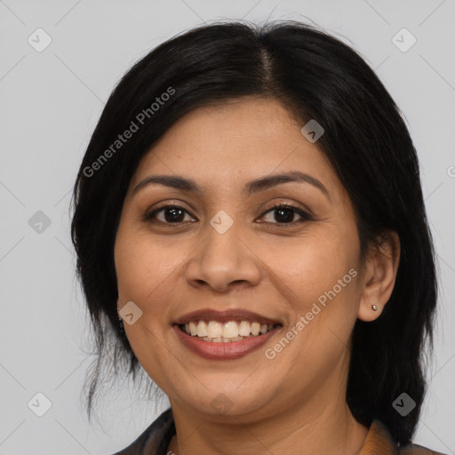 Joyful latino young-adult female with medium  black hair and brown eyes