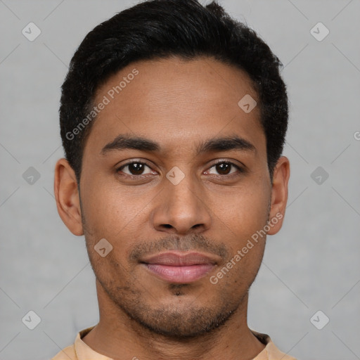 Joyful latino young-adult male with short  brown hair and brown eyes