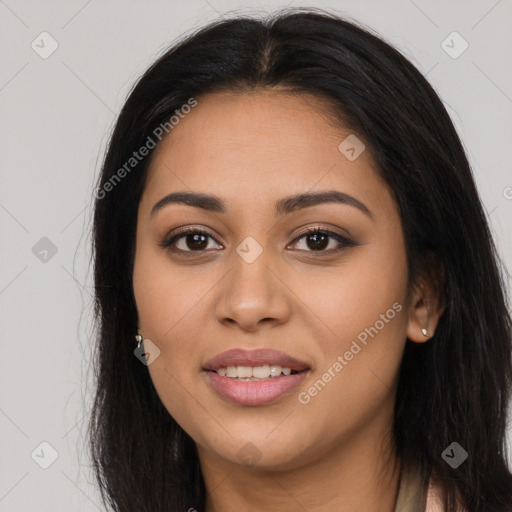 Joyful latino young-adult female with long  brown hair and brown eyes