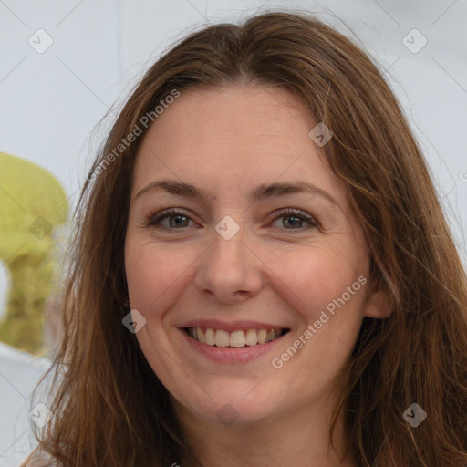 Joyful white adult female with long  brown hair and brown eyes