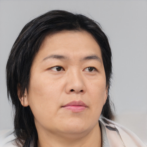 Neutral asian adult female with medium  brown hair and brown eyes