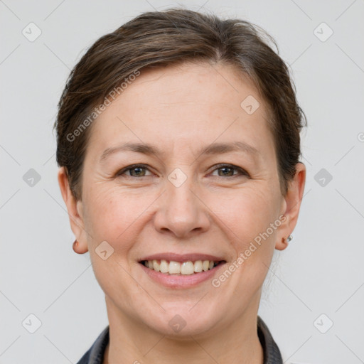 Joyful white adult female with short  brown hair and grey eyes