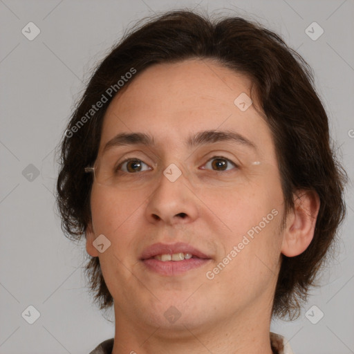 Joyful white adult female with medium  brown hair and brown eyes