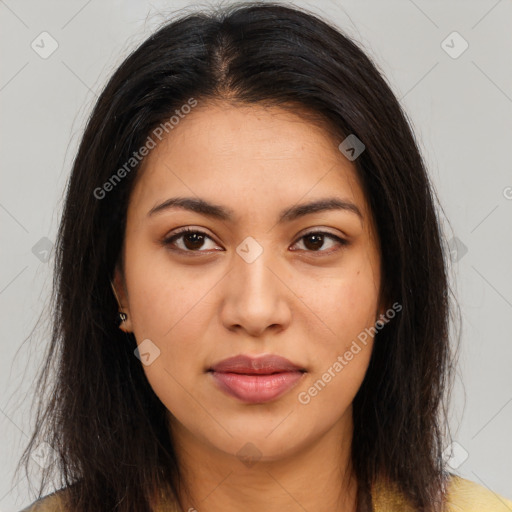 Joyful latino young-adult female with long  brown hair and brown eyes