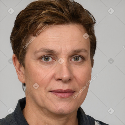 Joyful white adult female with short  brown hair and grey eyes