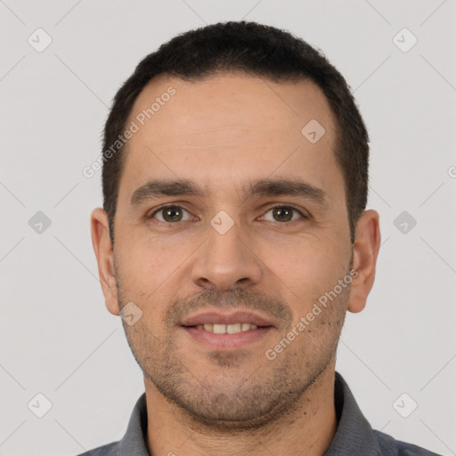 Joyful white young-adult male with short  brown hair and brown eyes