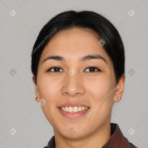 Joyful asian young-adult female with short  black hair and brown eyes