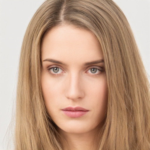 Neutral white young-adult female with long  brown hair and brown eyes