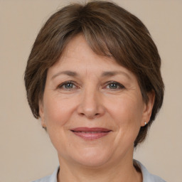 Joyful white adult female with medium  brown hair and brown eyes