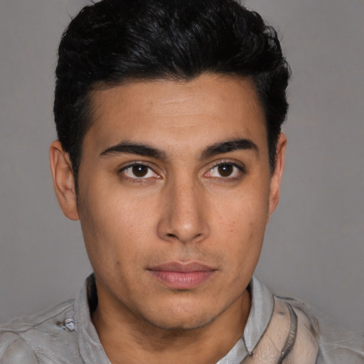 Neutral latino young-adult male with short  brown hair and brown eyes