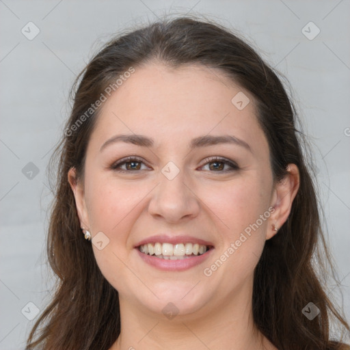 Joyful white young-adult female with long  brown hair and grey eyes