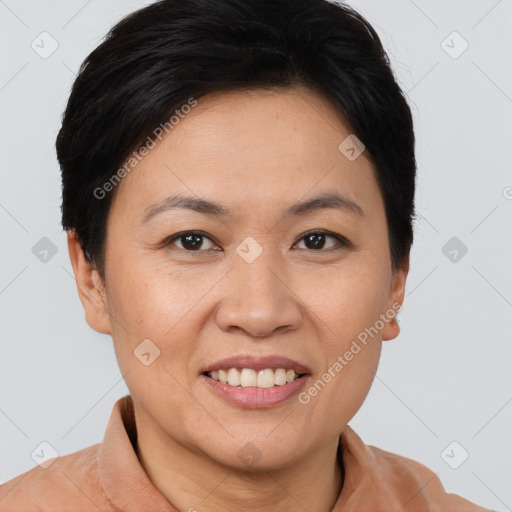 Joyful asian adult female with short  brown hair and brown eyes