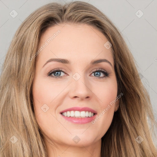 Joyful white young-adult female with long  brown hair and green eyes