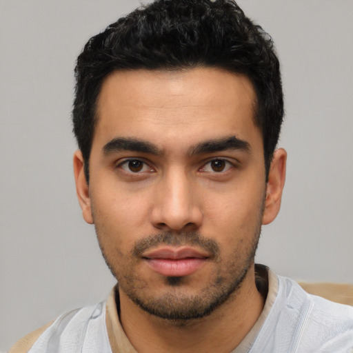Neutral latino young-adult male with short  black hair and brown eyes