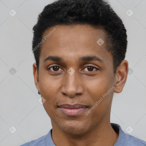 Joyful black young-adult male with short  black hair and brown eyes