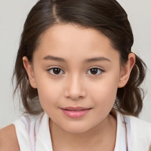 Joyful white child female with medium  brown hair and brown eyes