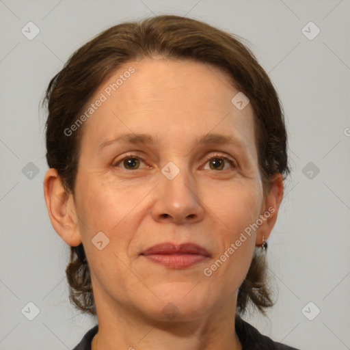 Joyful white adult female with medium  brown hair and brown eyes