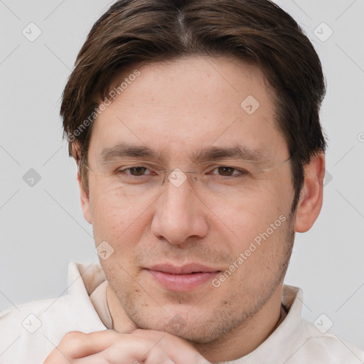 Joyful white adult male with short  brown hair and brown eyes