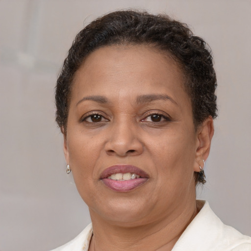 Joyful latino adult female with short  brown hair and brown eyes