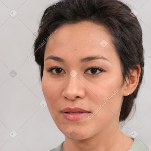 Joyful white adult female with medium  brown hair and brown eyes