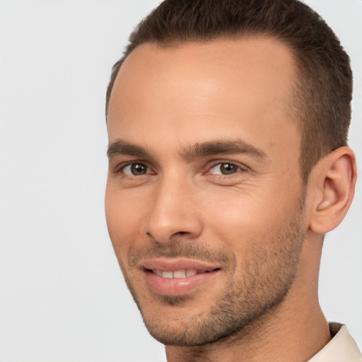 Joyful white young-adult male with short  brown hair and brown eyes