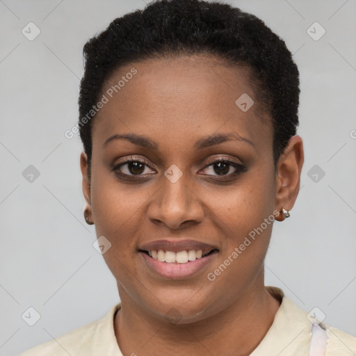 Joyful black young-adult female with short  black hair and brown eyes